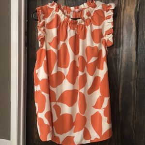 Orange and cream sleeveless blouse
